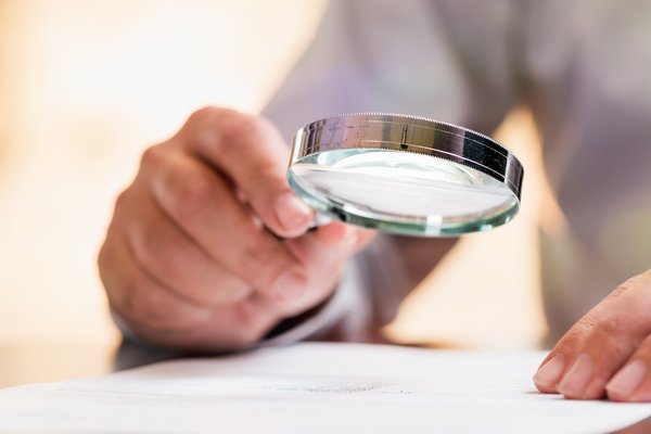 take a close look research fine print examine magnifying glass study